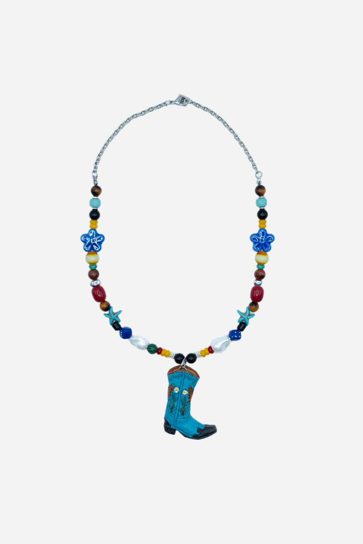 Gringo Boot Turquesa, dettaglio dello stivale turchese con motivi floreali e perline multicolore